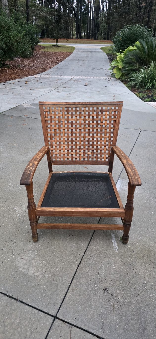 Weathered gray teak chair before outdoor furniture cleaning in Hilton Head, SC